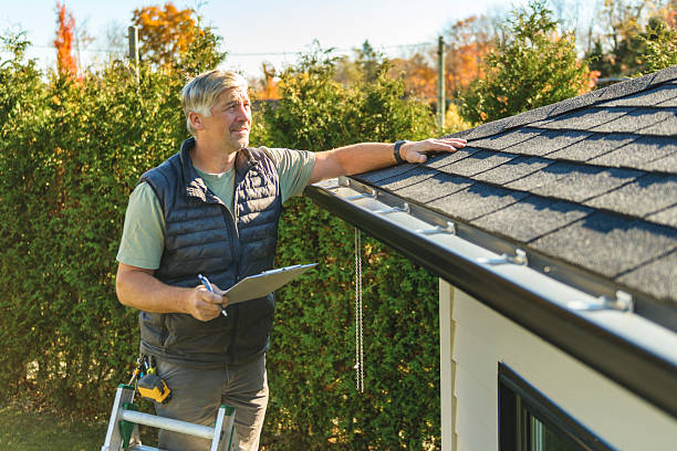 Professional Roofing technician working in Winburne, PA